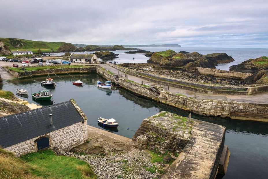 bigstock Ballintoy Harbor With Boats An 280636996