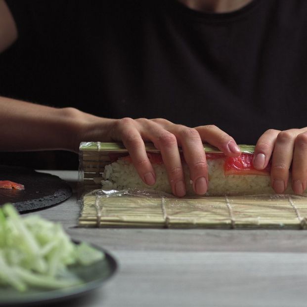 bigstock Japanese Chef Prepares Sushi R 390231056