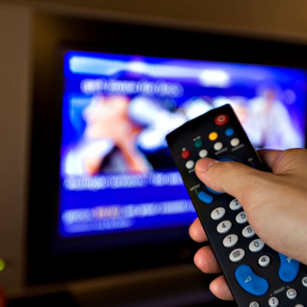 bigstock Hand pointing a tv remote cont 18496238